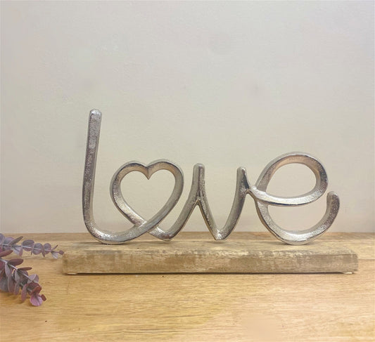 Metal Silver Love Ornament On A Wooden Base